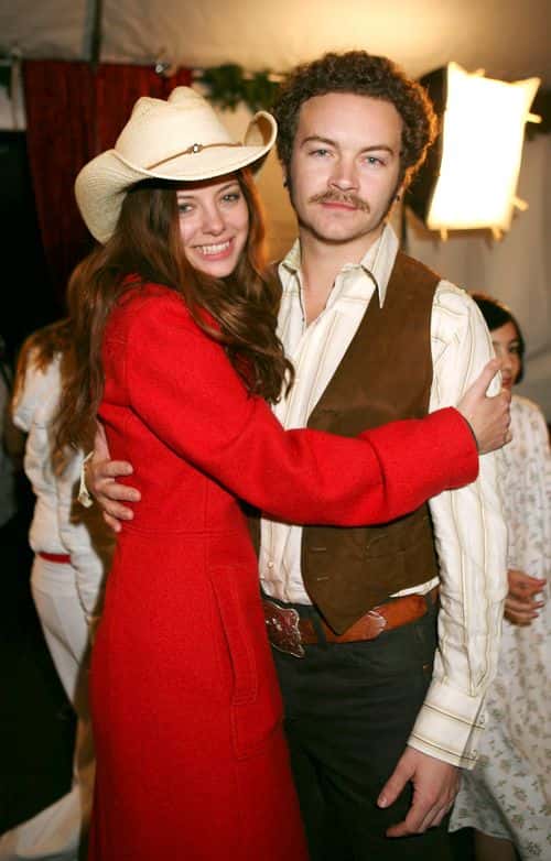 Actors Bijou Phillips and Danny Masterson pose backstage during the Church of Scientology's 