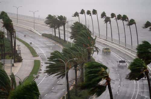 Motorists travel across the John Ringling Causeway as Hurricane Ian churns to the south on September 28, 2022 in Sarasota, Florida. The storm made a U.S. landfall at Cayo Costa, Florida this afternoon as a Category 4 hurricane with wind speeds over 140 miles per hour in some areas.