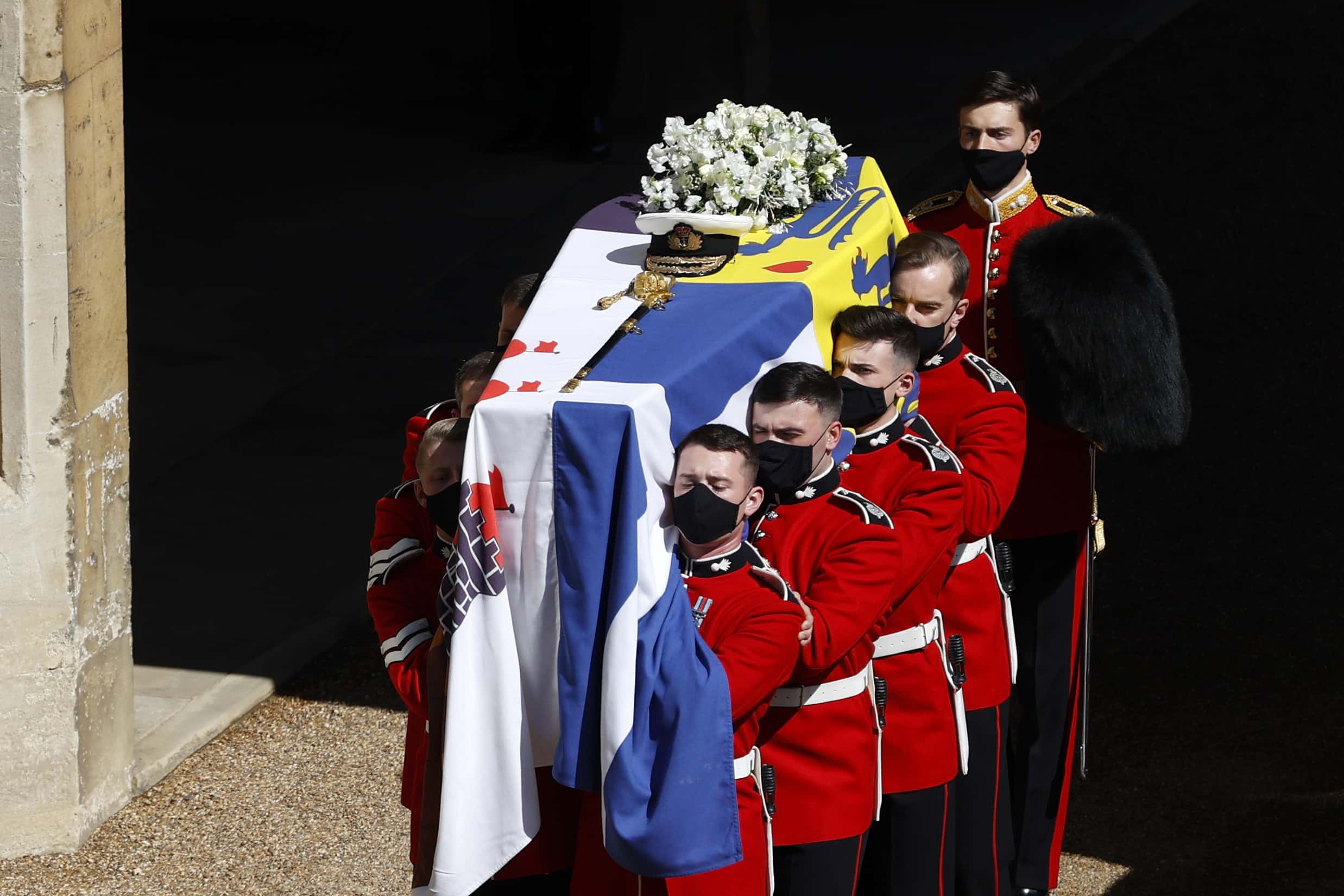 The bearer Party found by The Queen’s Company, 1st Battalion Grenadier Guards carry the coffin of HRH Prince Philip, Duke of Edinburgh to the purpose built Land Rover Hearse during the funeral of Prince Philip, Duke of Edinburgh at Windsor Castle on April 17, 2021 in Windsor, England. Prince Philip of Greece and Denmark was born 10 June 1921, in Greece. He served in the British Royal Navy and fought in WWII. He married the then Princess Elizabeth on 20 November 1947 and was created Duke of Edinburgh, Earl of Merioneth, and Baron Greenwich by King VI. He served as Prince Consort to Queen Elizabeth II until his death on April 9 2021, months short of his 100th birthday. His funeral takes place today at Windsor Castle with only 30 guests invited due to Coronavirus pandemic restrictions.