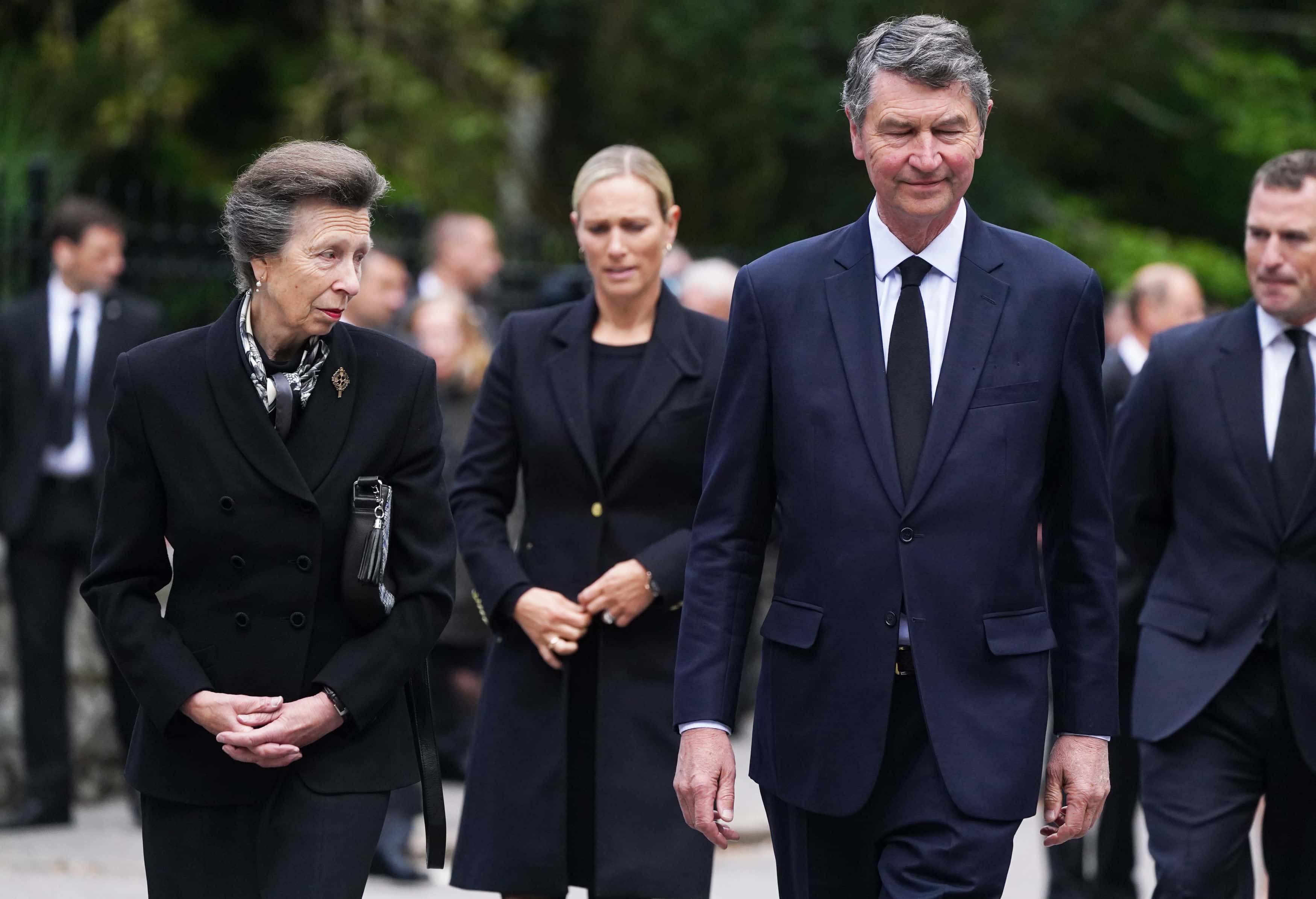 Peter Phillips, Zara Tindall, Princess Anne, Princess Royal and Vice Admiral Timothy Laurence look arrive to look messages and floral tributes left by members of the public after attending a service at Crathie Kirk church near Balmoral following the death of Queen Elizabeth II on September 10, 2022 in Crathie near Aberdeen, United Kingdom. (Photo by Owen Humphreys-WPA Pool/Getty Images)