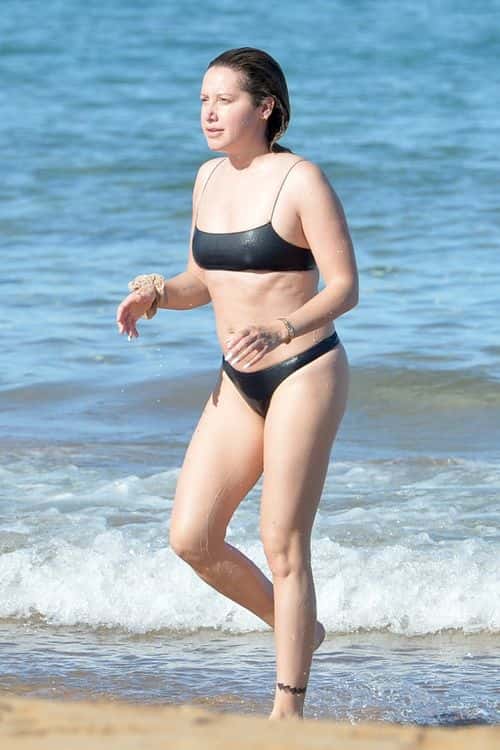 Ashley Tisdale goes for a dip in the beach. (Backgrid)