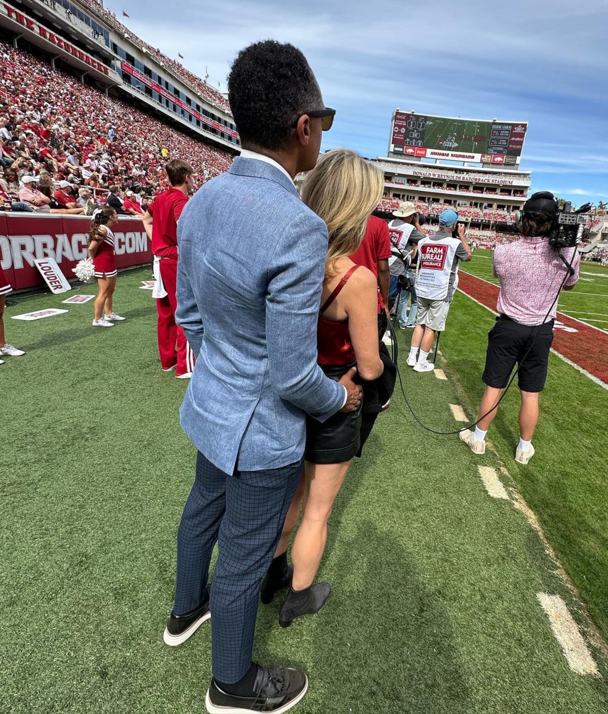 The former 'GMA' stars enjoyed the game while holding hands (@officialTJholmes/Instagram)
