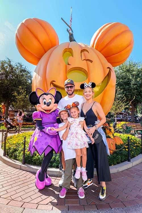 In this handout image provided by Disneyland Resort, actress Kate Hudson and her family celebrate her daughter Rani Rose's birthday with Minnie Mouse during Halloween Time at Disneyland Park on September 26, 2022 in Anaheim, California. (Photo by Sean Teegarden/Disneyland Resort via Getty Images)