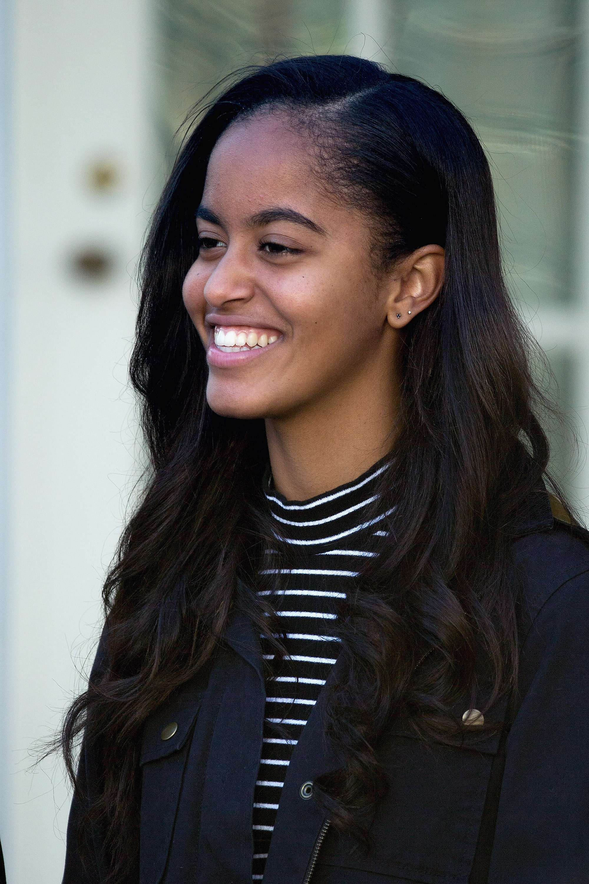 Malia Obama, daughter of U.S. President Barack Obama, participates in the turkey pardoning ceremony in the Rose Garden at the White House November 25, 2015 in Washington, DC. In a tradition dating back to 1947, the president pardons a turkey, sparing the tom -- and his alternate -- from becoming a Thanksgiving Day feast. This year, Americans were asked to choose which of two turkeys would be pardoned and to cast their votes on Twitter.