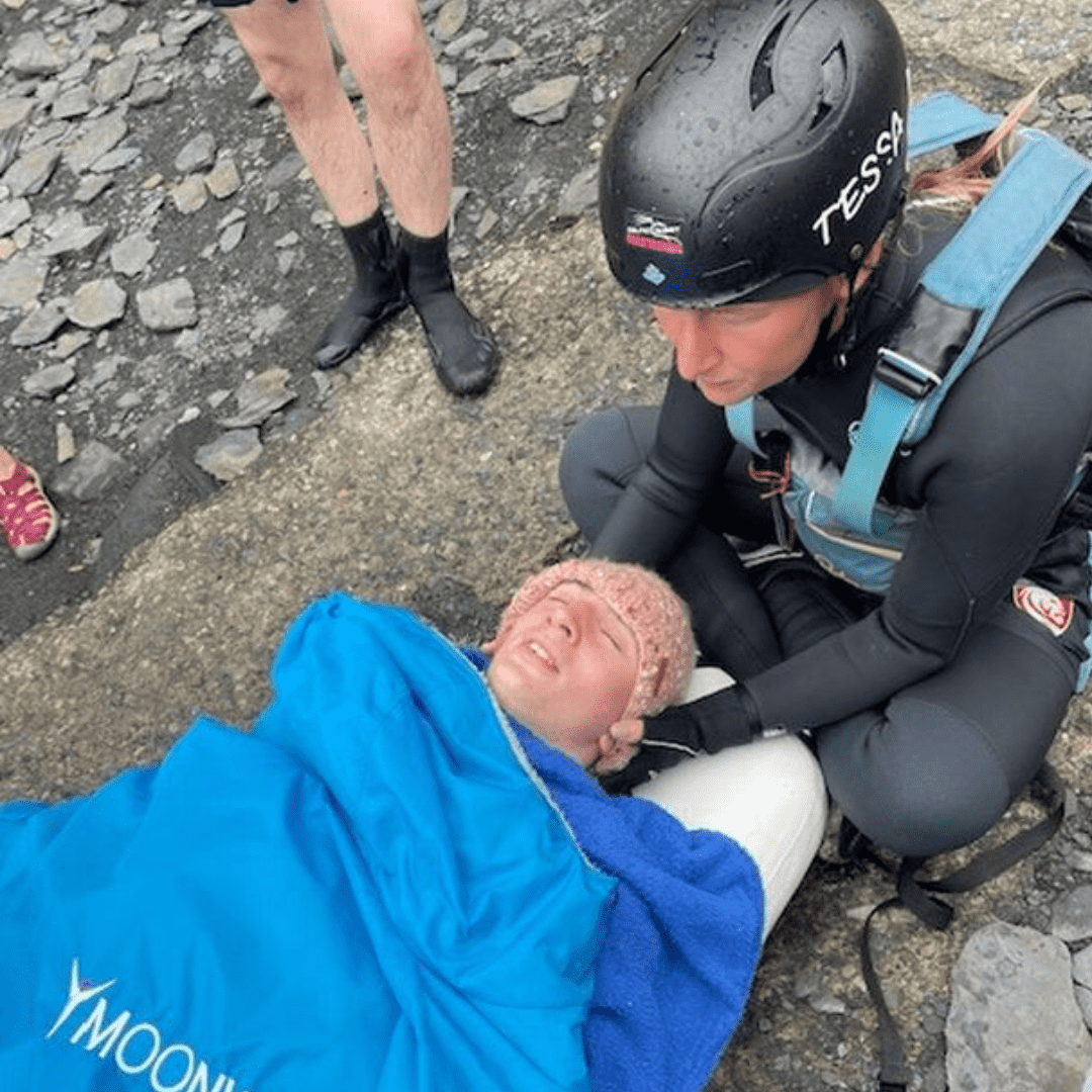 Sam is looked after by Tessa from Celtic Quest Coasteering prior to being airlifted to the waiting ambulance (Lindsay Wilson via Wales News)