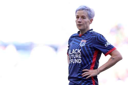 Megan Rapinoe #15 of OL Reign looks on against the Portland Thorns FC during the first half at Lumen Field on June 03, 2023 in Seattle, Washington.