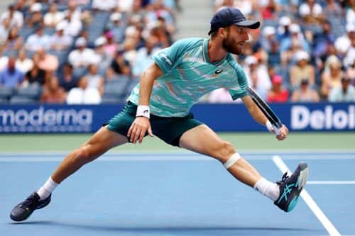 Corentin Moutet of France returns a shot against Casper Ruud of Norway during their Men's Singles Fourth Round match on Day Seven of the 2022 US Open at USTA Billie Jean King National Tennis Center on September 04, 2022 in the Flushing neighborhood of the Queens borough of New York City.