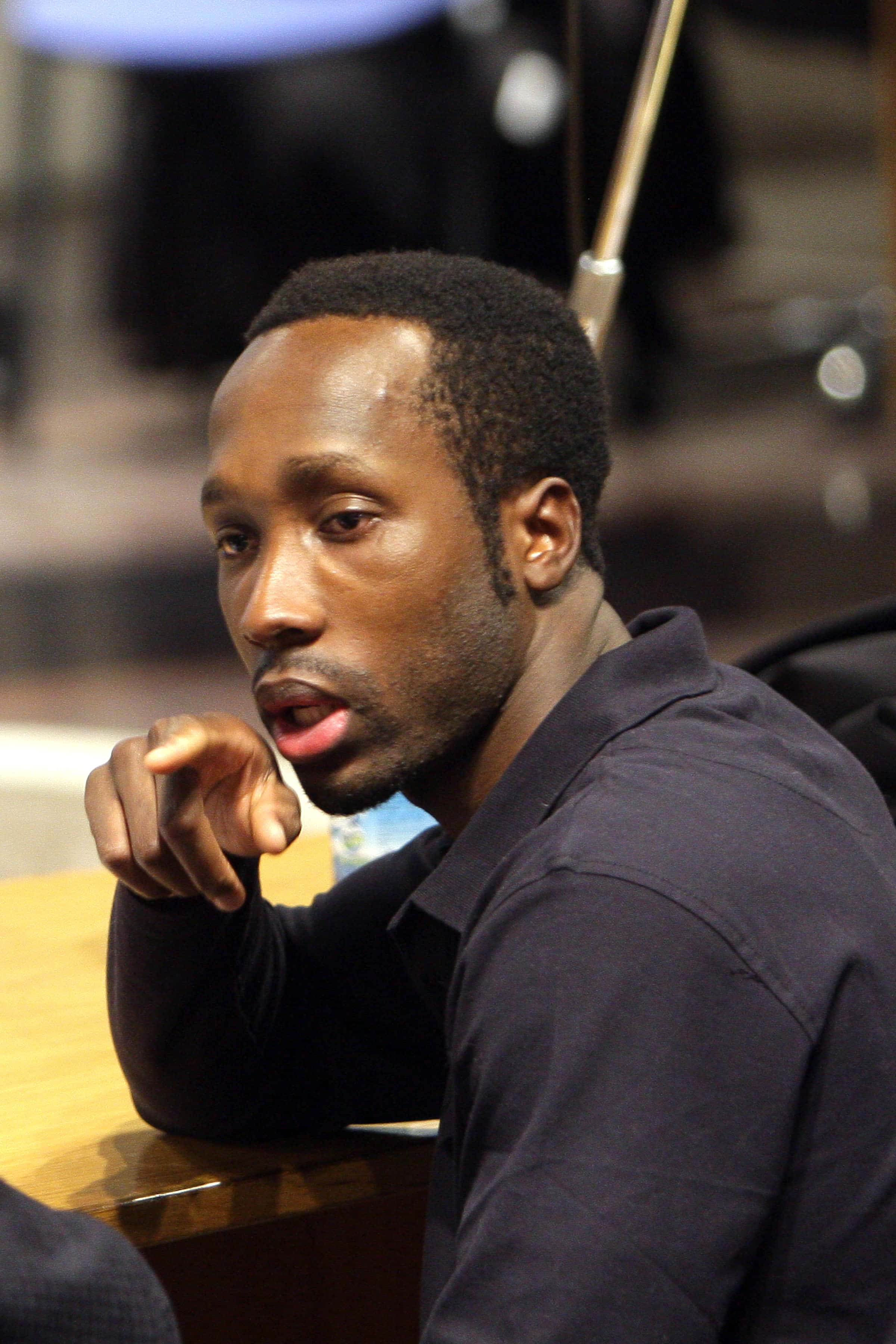 PERUGIA, ITALY - NOVEMBER 18:  Rudy Guede, who was born in the Ivory Coast chats with his lawyer's a