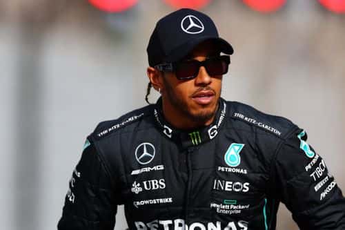 Lewis Hamilton of Great Britain and Mercedes looks on ahead of the F1 2022 End of Year photo prior to the F1 Grand Prix of Abu Dhabi at Yas Marina Circuit on November 20, 2022 in Abu Dhabi, United Arab Emirates.