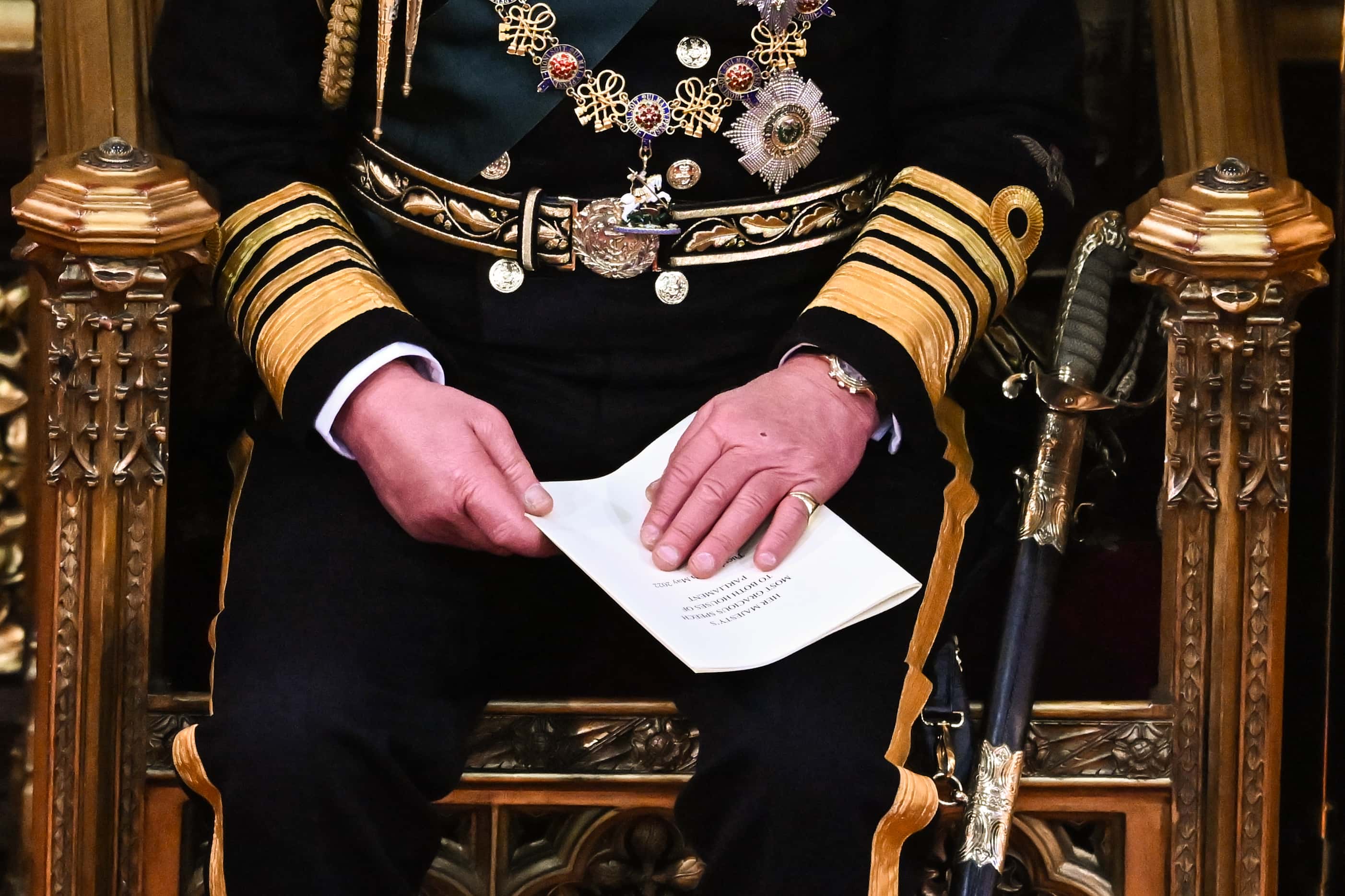 Prince Charles, Prince of Wales holds the Queen's Speech in his hands after reading it in the House of Lords Chamber, during the State Opening of Parliament in the House of Lords at the Palace of Westminster on May 10, 2022 in London, England. The State Opening of Parliament formally marks the beginning of the new session of Parliament. It includes Queen's Speech, prepared for her to read from the throne, by her government outlining its plans for new laws being brought forward in the coming parliamentary year. This year the speech will be read by the Prince of Wales as HM The Queen will miss the event due to ongoing mobility issues.
