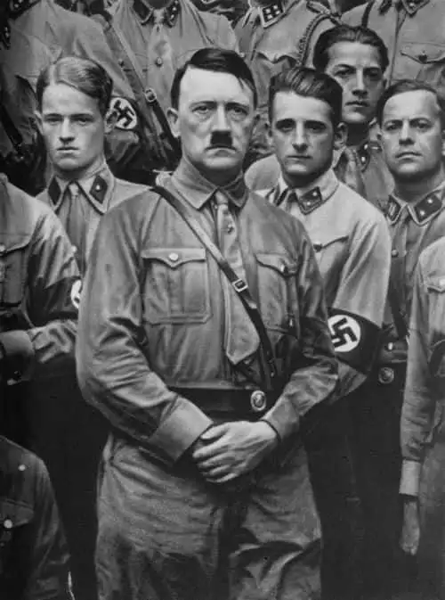 German Nazi Party Leader Adolf Hitler (1889 - 1945) with some young members of the Sturmabteilung during a rally, circa 1930.  (Photo by Three Lions/Hulton Archive/Getty Images)
