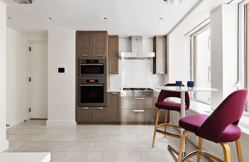 The eat-in kitchen was renovated as well with Miele, Bertazzoni appliances and custom Italian cabinets being added (Compass)