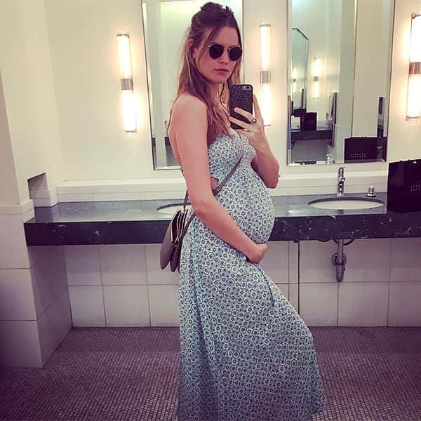 Behati Prinsloo shows off her baby bump. (Photo via @behatiprinsloo/Instagram)