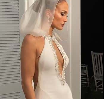 JLO in her mermaid-styled wedding gown with pearls sewn into it (Screenshot via OnTheJLO.com)