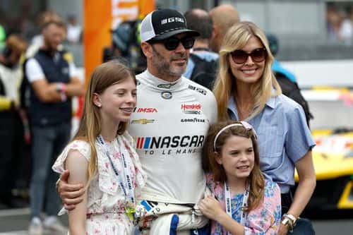 Jimmie Johnson of the #24 NASCAR Next Gen Chevrolet ZL1 looks on with his family during the 100th anniversary of the 24 Hours of Le Mans at the Circuit de la Sarthe June 10, 2023 in Le Mans, France.
