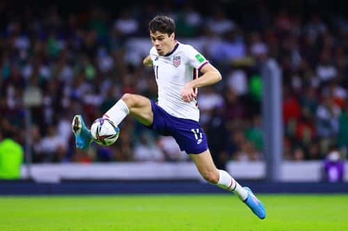Giovanni Reyna of United States drives the ball during the match between Mexico and The United States as part of the Concacaf 2022 FIFA World Cup Qualifiers at Azteca Stadium on March 24, 2022 in Mexico City, Mexico.