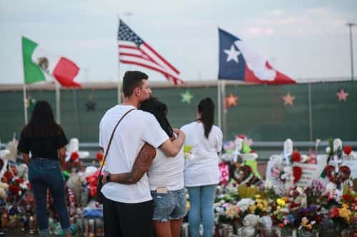 People gather at a makeshift memorial honoring victims outside Walmart August 15, 2019 in El Paso, Texas. 22 people were killed in the Walmart during a mass shooting on August 3rd. A 21-year-old white male suspect remains in custody in El Paso which sits along the U.S.-Mexico border.