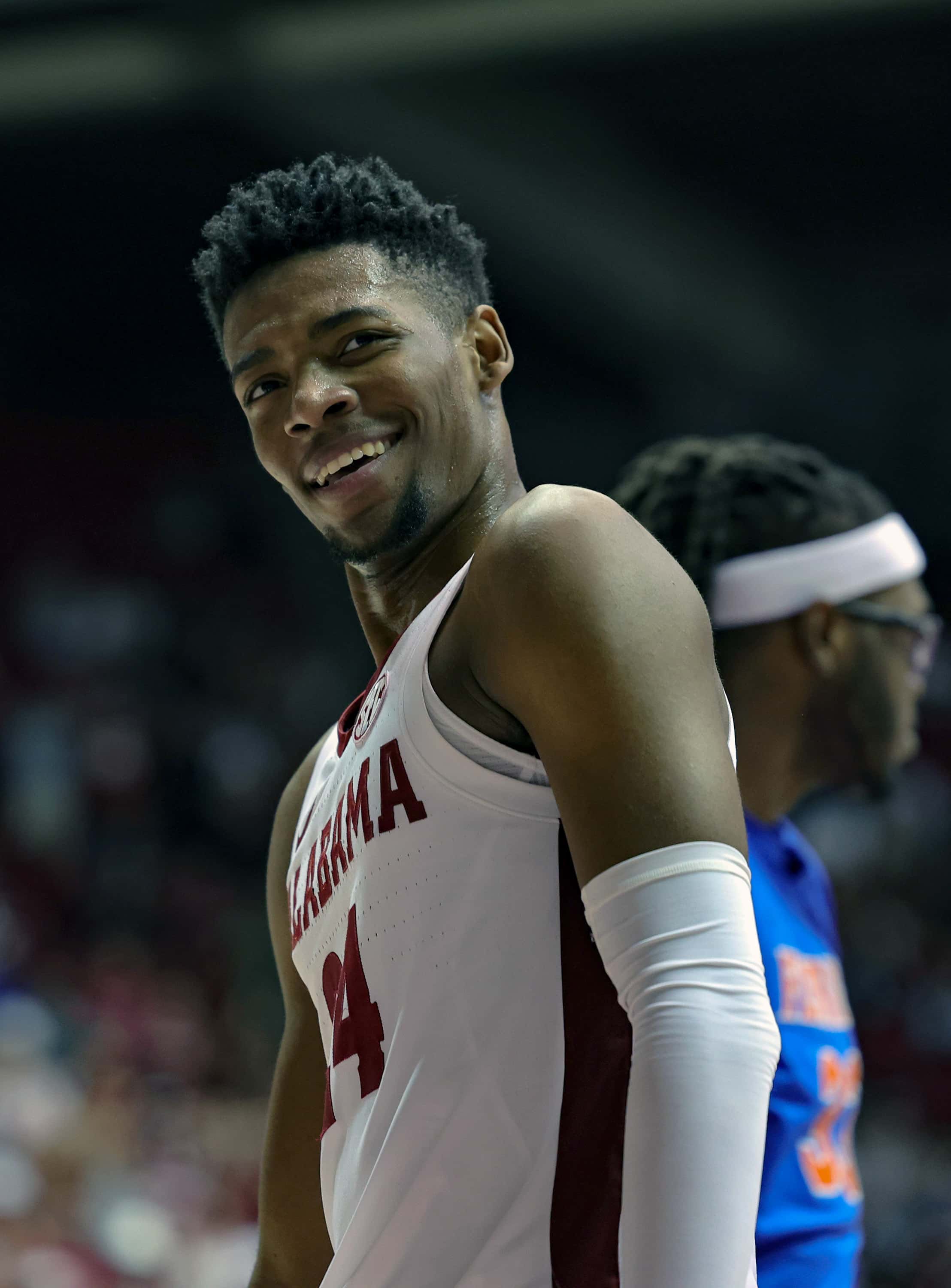 Brandon Miller #24 of the Alabama Crimson Tide is all smiles during a second half timeout against the Florida Gators at Coleman Coliseum on February 8, 2023 in Tuscaloosa, Alabama.