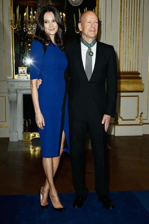Bruce Willis poses with his wife Emma Heming-Willis after being awarded Commandeur dans l'Ordre des Arts et Lettres at Ministere de la Culture on February 11, 2013 in Paris, France.