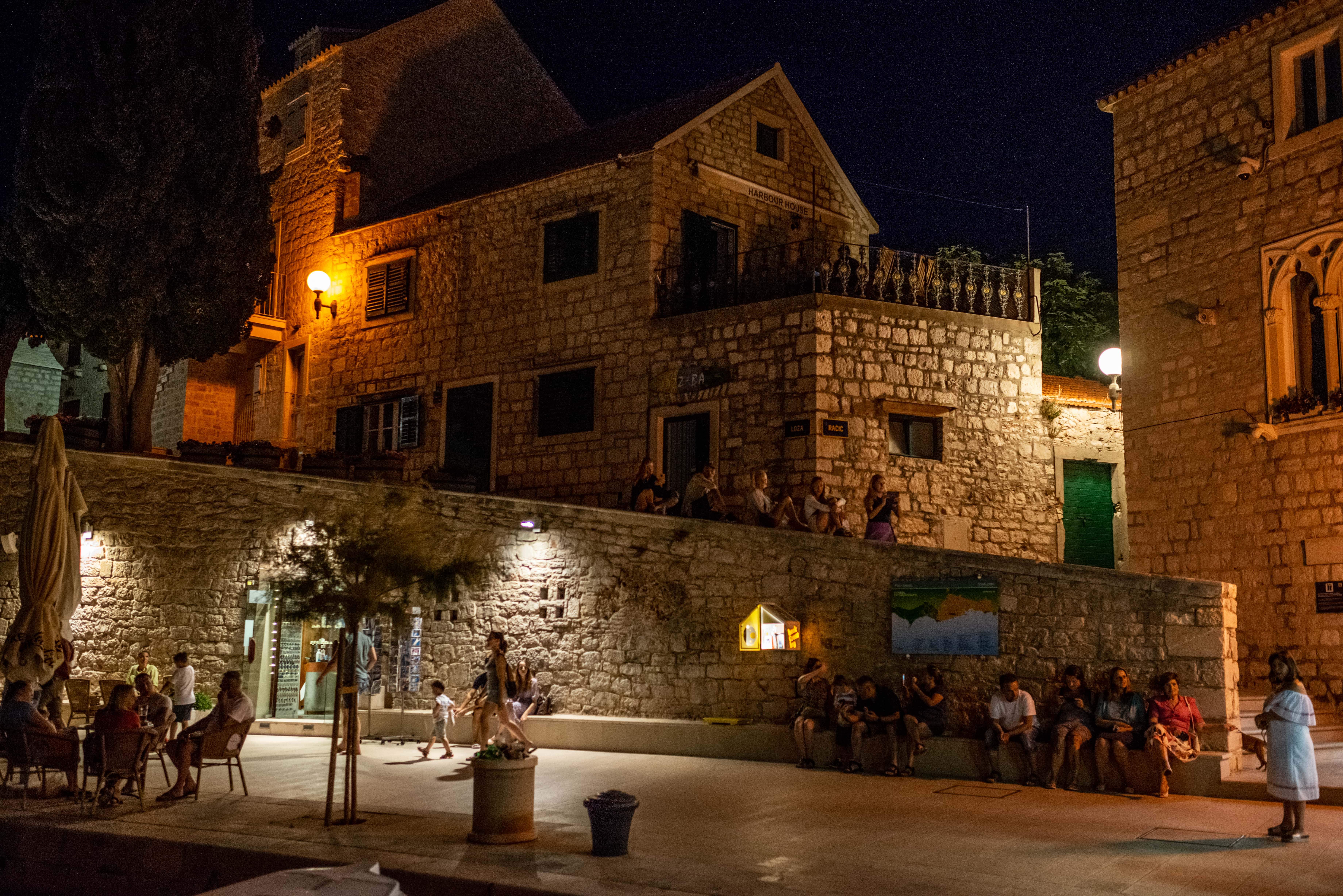 Some tourists enjoy an ice cream and fresh air sitting on the town's promenade on June 27, 2021 in Bol, Croatia. Croatia has already reported a 40 percent increase in tourists relative to last year, when the Covid-19 pandemic dampened tourism across the continent.