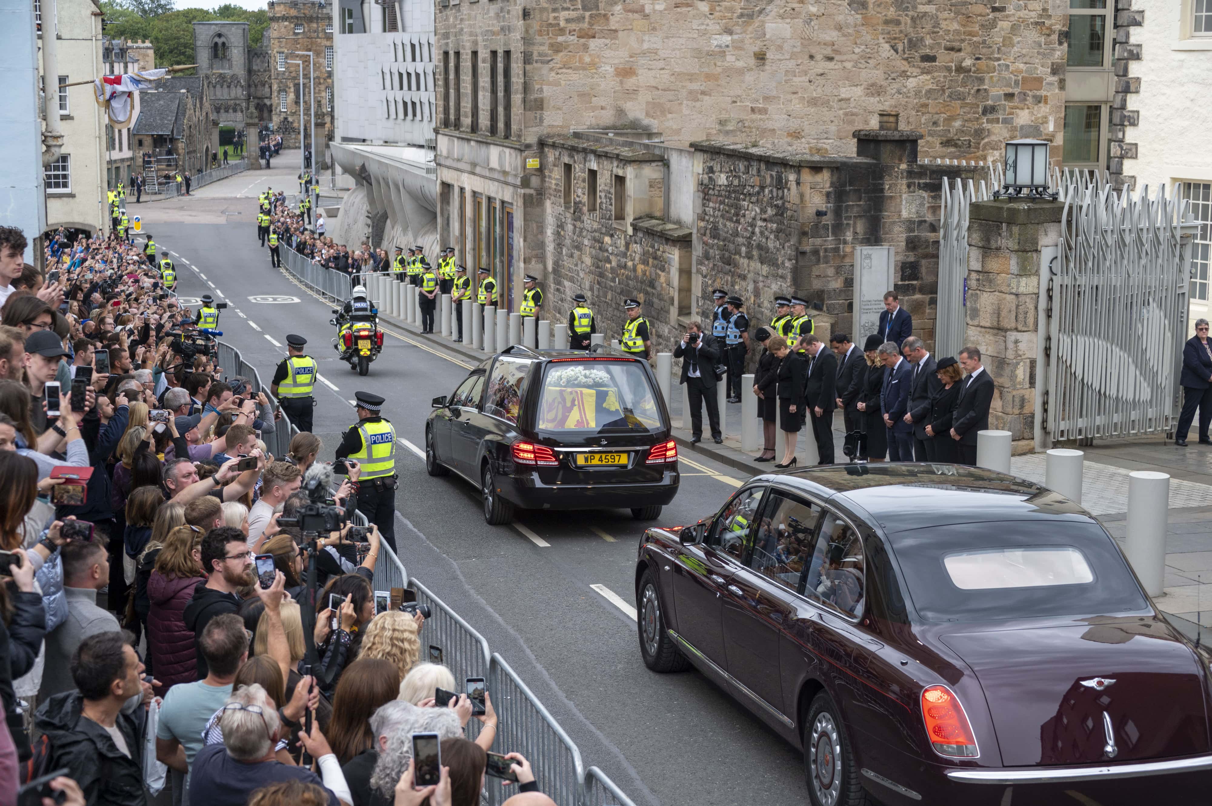 Scotland's First Minister Nicola Sturgeon and leaders of the Scottish political parties join members of the public as the cortege with the hearse carrying the coffin of the late Queen Elizabeth II, draped with the Royal Standard of Scotland, passes down the Royal Mile, Edinburgh, on the journey from Balmoral to the Palace of Holyroodhouse on September 11, 2022 in Edinburgh, United Kingdom. Elizabeth Alexandra Mary Windsor was born in Bruton Street, Mayfair, London on 21 April 1926. She married Prince Philip in 1947 and ascended the throne of the United Kingdom and Commonwealth on 6 February 1952 after the death of her Father, King George VI. Queen Elizabeth II died at Balmoral Castle in Scotland on September 8, 2022, and is succeeded by her eldest son, King Charles III.