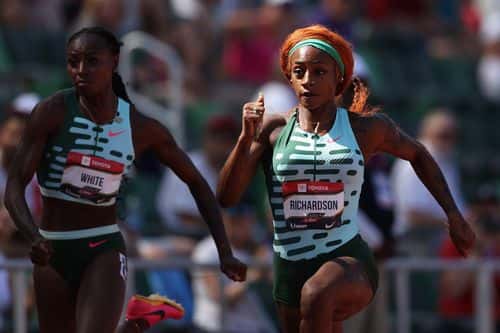 Sha'Carri Richardson (R) competes in the Women's 100m during the 2023 USATF Outdoor Championships at Hayward Field on July 06, 2023 in Eugene, Oregon.