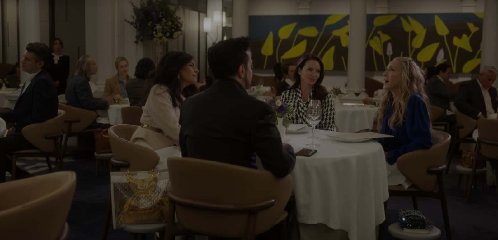 A still from 'And Just Like That' Season 2 Episode 1 starring Sarah Jessica Parker as Carrie Bradshaw, Kristin Davis as Charlotte, Sarita Choudhary as Seema, and Mario Cantone as Anthony (HBO)
