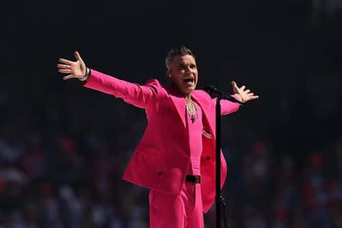 Robbie Williams performs during the 2022 AFL Grand Final match between the Geelong Cats and the Sydney Swans at the Melbourne Cricket Ground on September 24, 2022 in Melbourne, Australia.