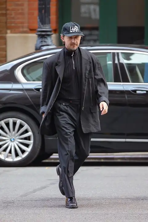 The actor completed his look with a pair of black pants and a pair of shiny black dress shoes (backgrid)