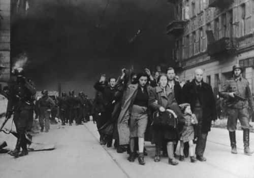 UNDATED FILE PHOTO: Jewish civilians are forced to march by SS soldiers in this 1943 photo during the destruction of the Warsaw Ghetto in Poland.