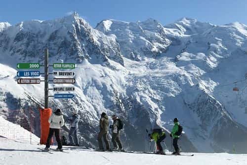 Alpine skiers prepare to descend on a piste at Le Brevent ski resort on February 24, 2018 near Chamonix-Mont-Blanc, France. The French Alps are a popular destination for skiers and climbers, though they are also dangerous. Several visitors have fallen to their deaths while skiing or snowboarding off piste just in recent weeks.