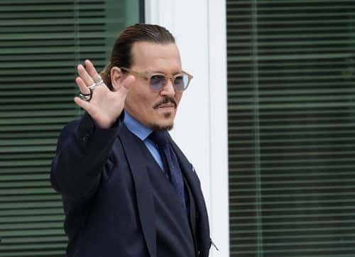 Actor Johnny Depp takes a break during his trial at a Fairfax County Courthouse on May 27, 2022 in Fairfax, Virginia. Closing arguments in the Depp v. Heard defamation trial, brought by Johnny Depp against his ex-wife Amber Heard, begins today.