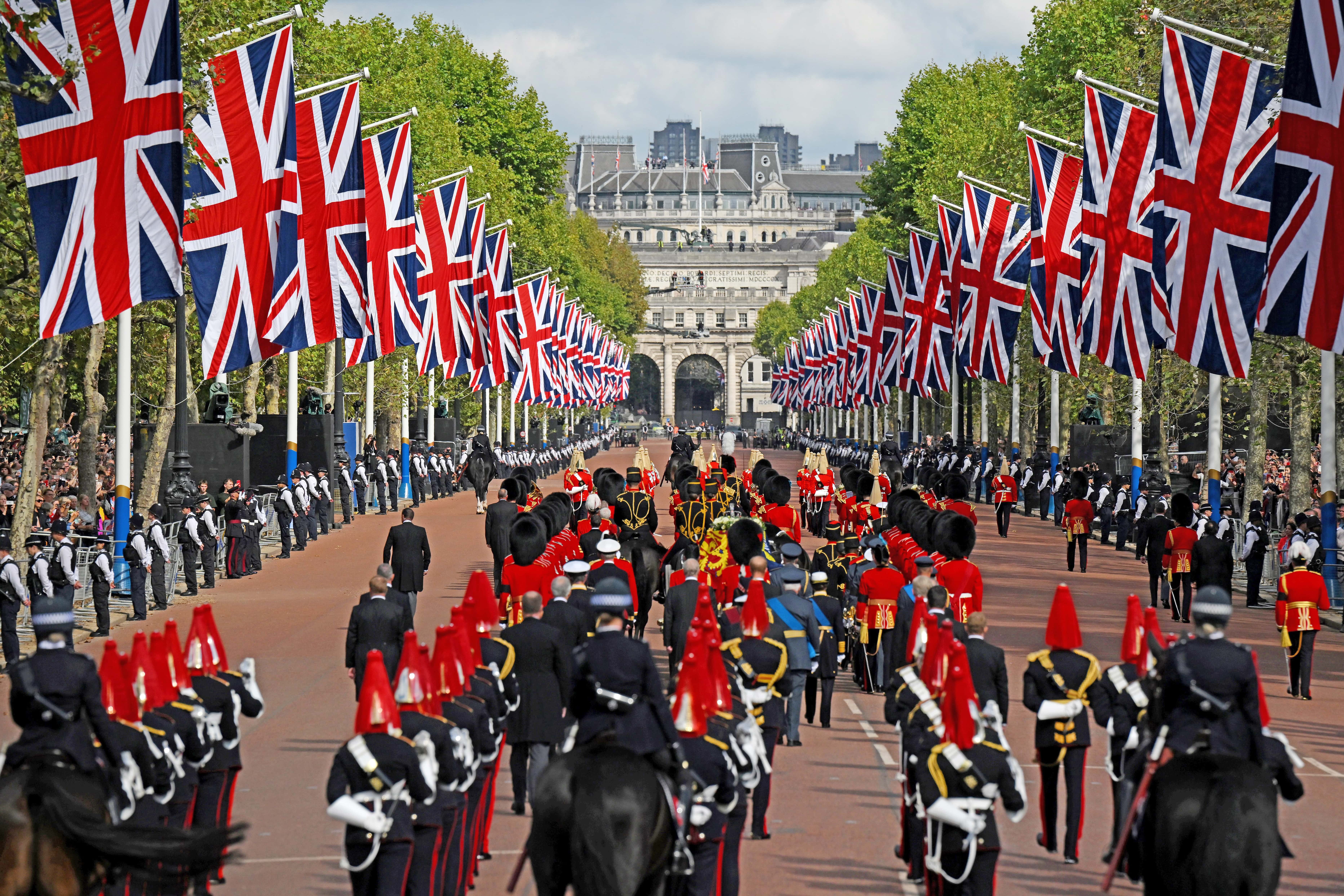 The coffin of Queen Elizabeth II, adorned with a Royal Standard and the Imperial State Crown is pulled by a Gun Carriage of The King's Troop Royal Horse Artillery, during a procession from Buckingham Palace to Westminster Hall on September 14, 2022 in London, United Kingdom. Queen Elizabeth II's coffin is taken in procession on a Gun Carriage of The King's Troop Royal Horse Artillery from Buckingham Palace to Westminster Hall where she will lay in state until the early morning of her funeral. Queen Elizabeth II died at Balmoral Castle in Scotland on September 8, 2022, and is succeeded by her eldest son, King Charles III.
