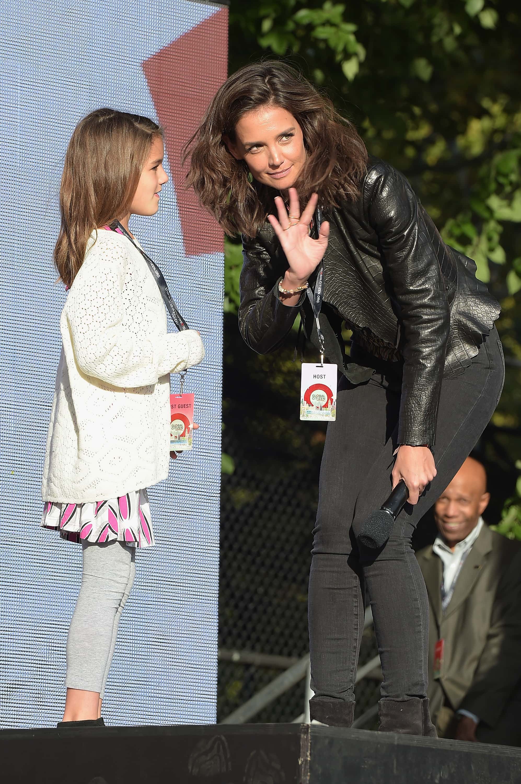 Suri Cruise (L) and actress Katie Holmes speak on stage at the 2015 Global Citizen Festival to end extreme poverty by 2030 in Central Park on September 26, 2015 in New York City. (Photo by Theo Wargo/Getty Images for Global Citizen)