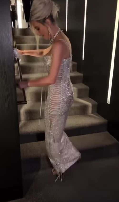 Kim grabbed the handrail to literally jump up the staircase (Instagram/kimkardashian)