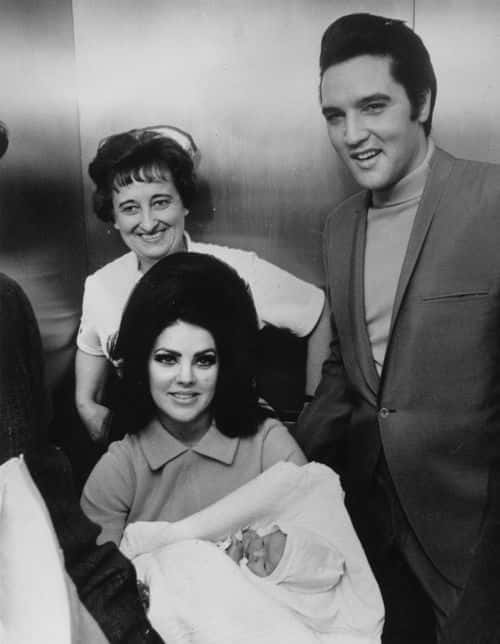 Rock 'n' roll superstar Elvis Presley with his wife Priscilla and their new-born baby Lisa Marie, at the Baptist Hospital at Memphis, Tennessee (Keystone/Getty Images)