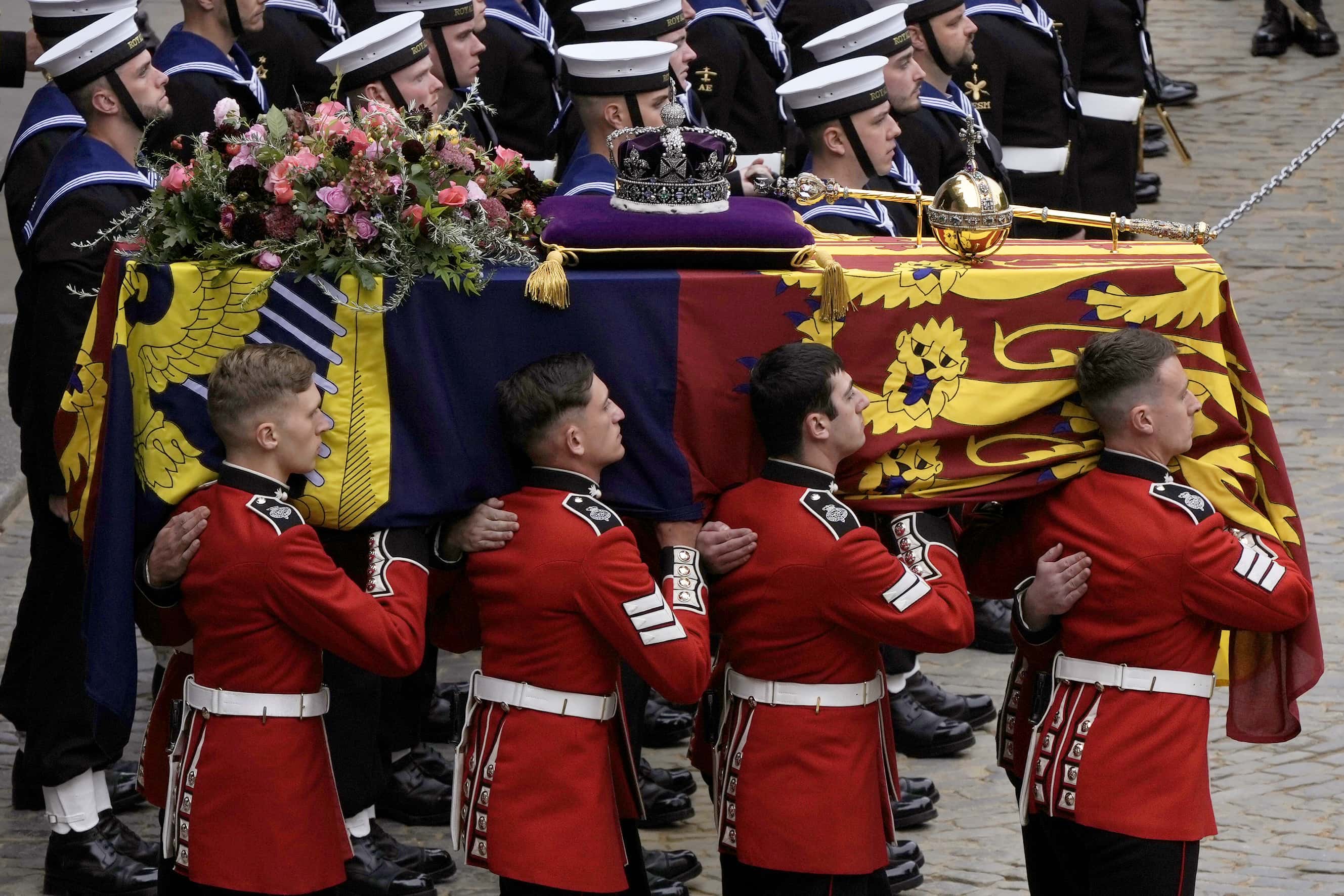 The coffin of Queen Elizabeth II is loaded on to a gun carriage pulled by Royal Navy soldiers to go from Westminster Hall for her funeral service in Westminster Abbey on September 19, 2022 in London, England. Elizabeth Alexandra Mary Windsor was born in Bruton Street, Mayfair, London on 21 April 1926. She married Prince Philip in 1947 and ascended the throne of the United Kingdom and Commonwealth on 6 February 1952 after the death of her Father, King George VI. Queen Elizabeth II died at Balmoral Castle in Scotland on September 8, 2022, and is succeeded by her eldest son, King Charles III. (Photo by Nariman El-Mofty - WPA Pool/Getty Images)