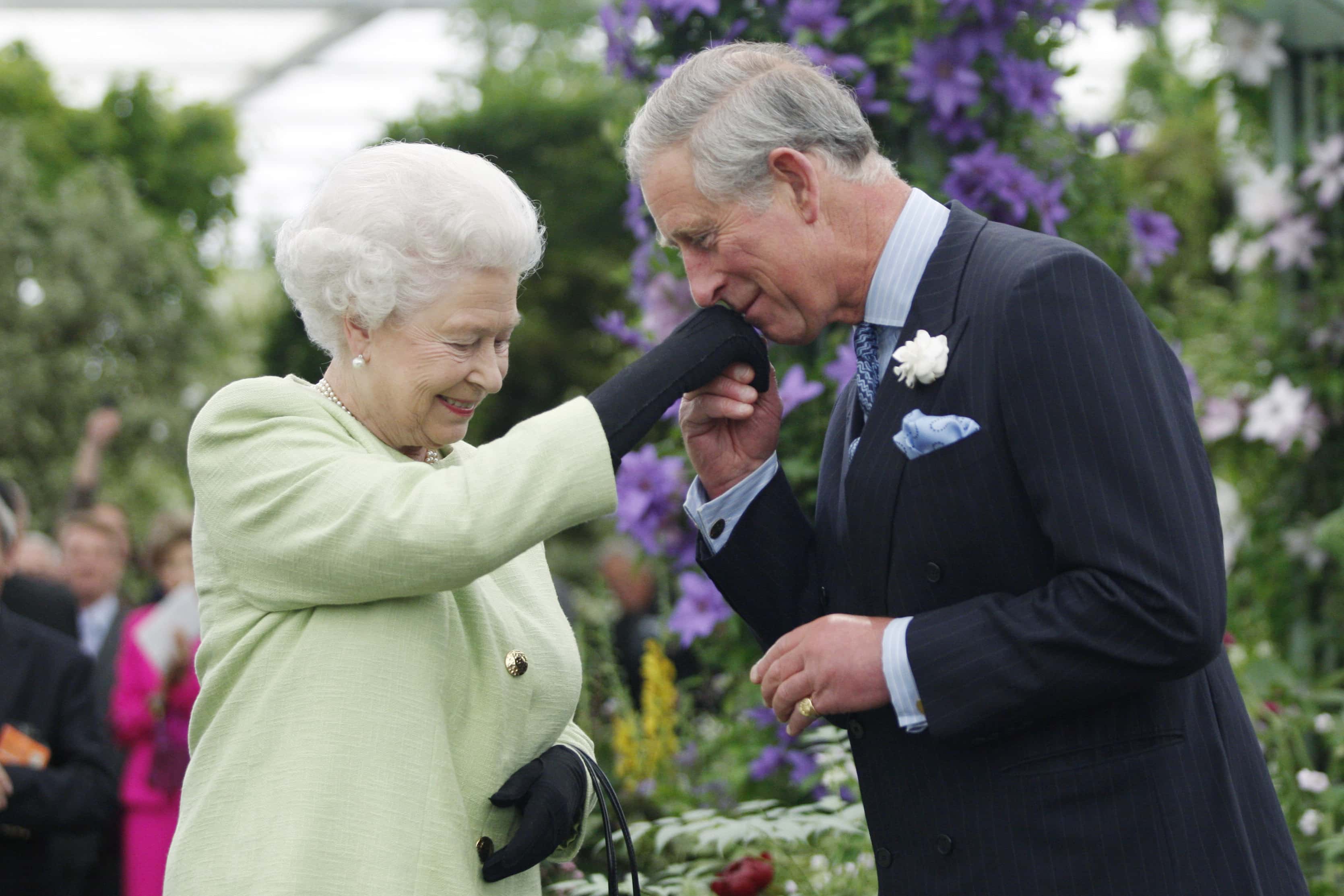 Queen Elizabeth II presents Prince Charles, Prince of Wales with the Royal Horticultural Society's Victoria Medal of Honour during a visit to the Chelsea Flower Show on May 18, 2009 in London. The Victoria Medal of Honour is the highest accolade that the Royal Horticultural Society can bestow.