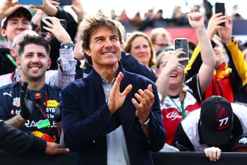 Tom Cruise applauds at the Podium celebrations during the F1 Grand Prix of Great Britain at Silverstone on July 03, 2022 in Northampton, England. (Photo by Mark Thompson/Getty Images)