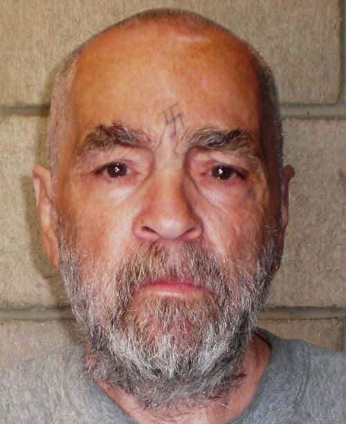 In this handout photo from the California Department of Corrections and Rehabilitation, Charles Manson, 74, poses for a photo on March 18, 2009 at Corcoran State Prison, California. Manson is serving a life sentence for conspiring to murder seven people during the