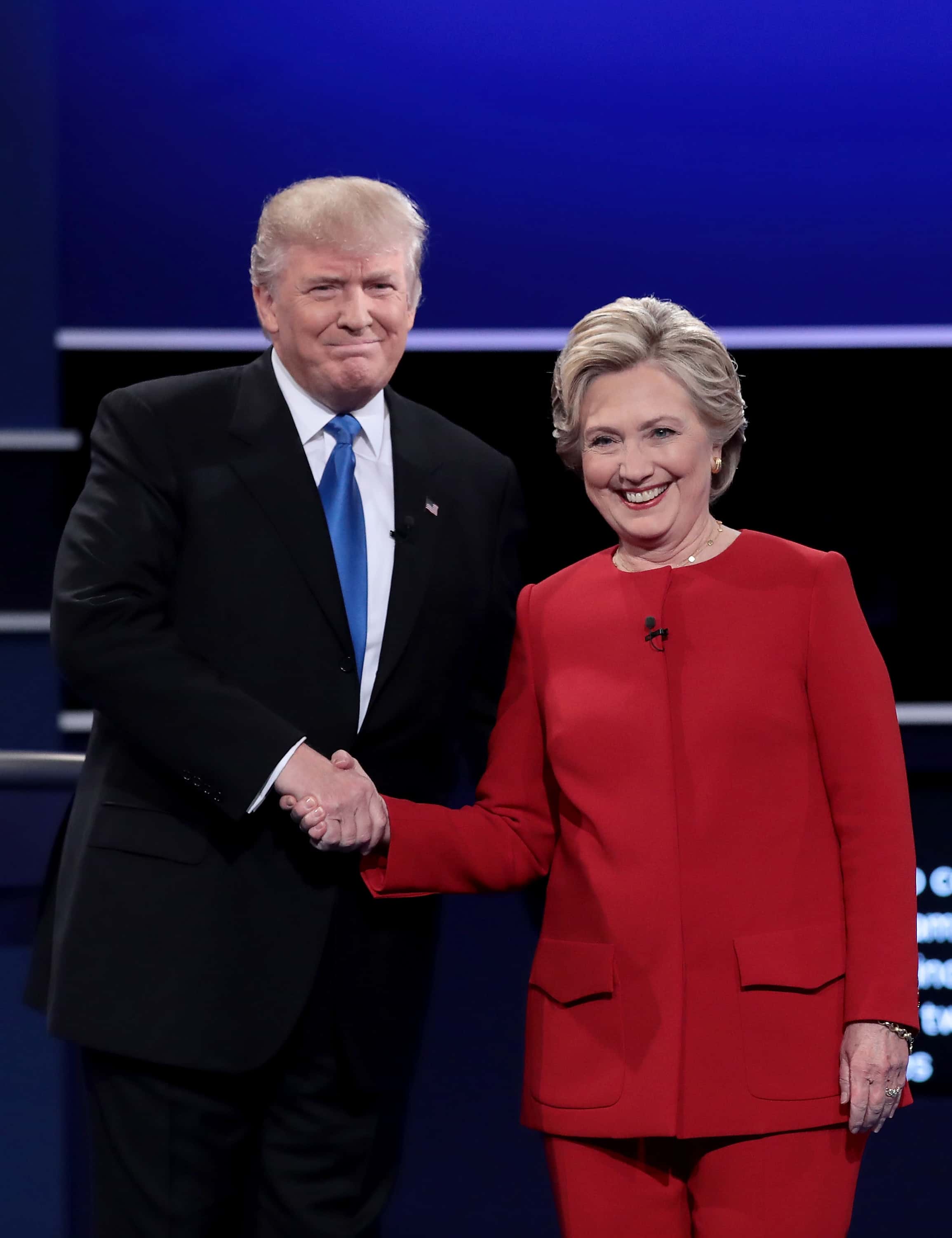 HEMPSTEAD, NY - SEPTEMBER 26: Democratic presidential nominee Hillary Clinton takes the stage with Republican presidential nominee Donald Trump during the Presidential Debate at Hofstra University on September 26, 2016 in Hempstead, New York. The first of four debates for the 2016 Election, three Presidential and one Vice Presidential, is moderated by NBC's Lester Holt. (Photo by Drew Angerer/Getty Images)
