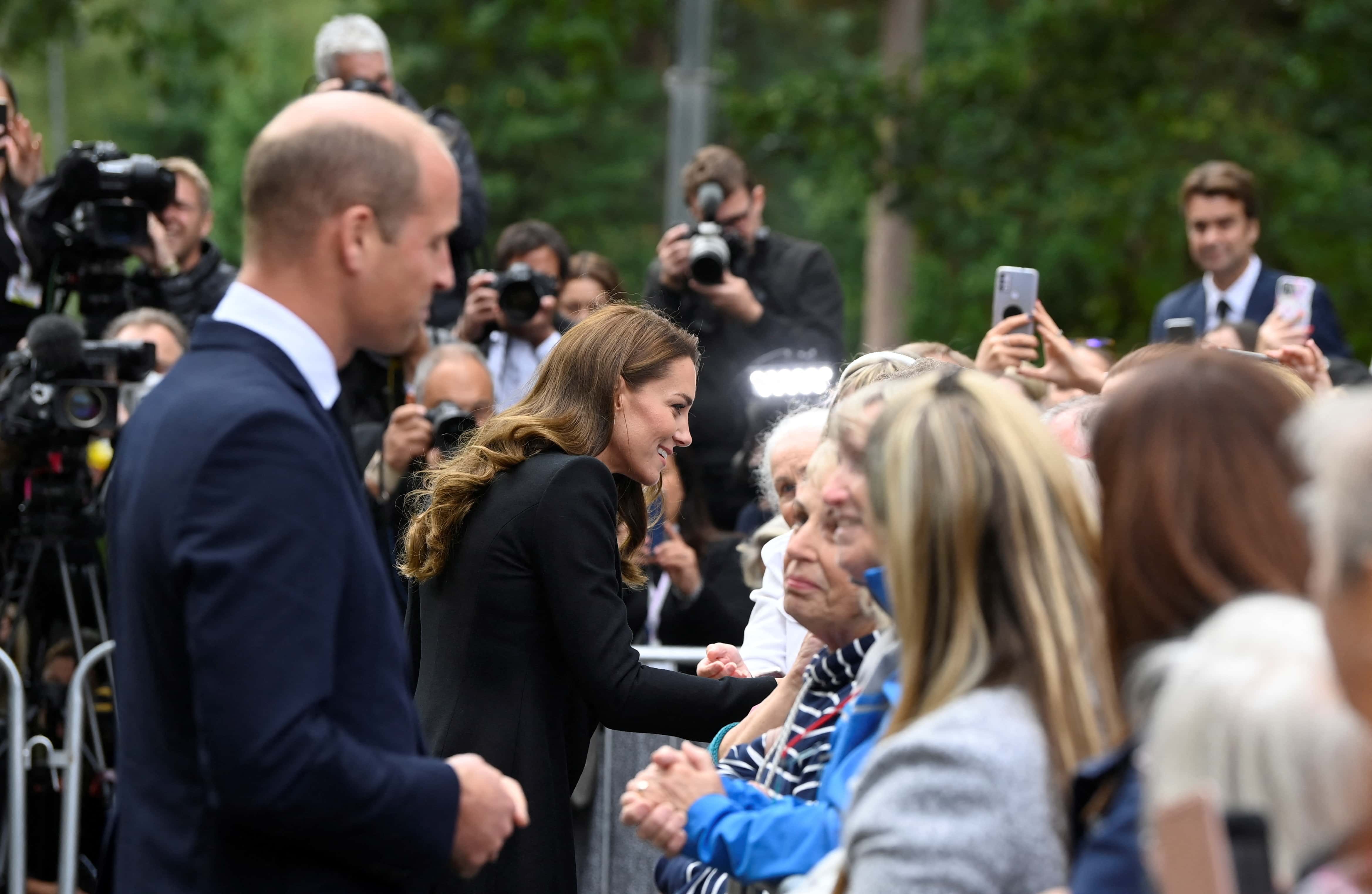 William, Prince of Wales, and Catherine, Princess of Wales, meet people gathered outside Sandringham Estate, following the death of Britain's Queen Elizabeth, on September 15, 2022 in Sandringham, England.