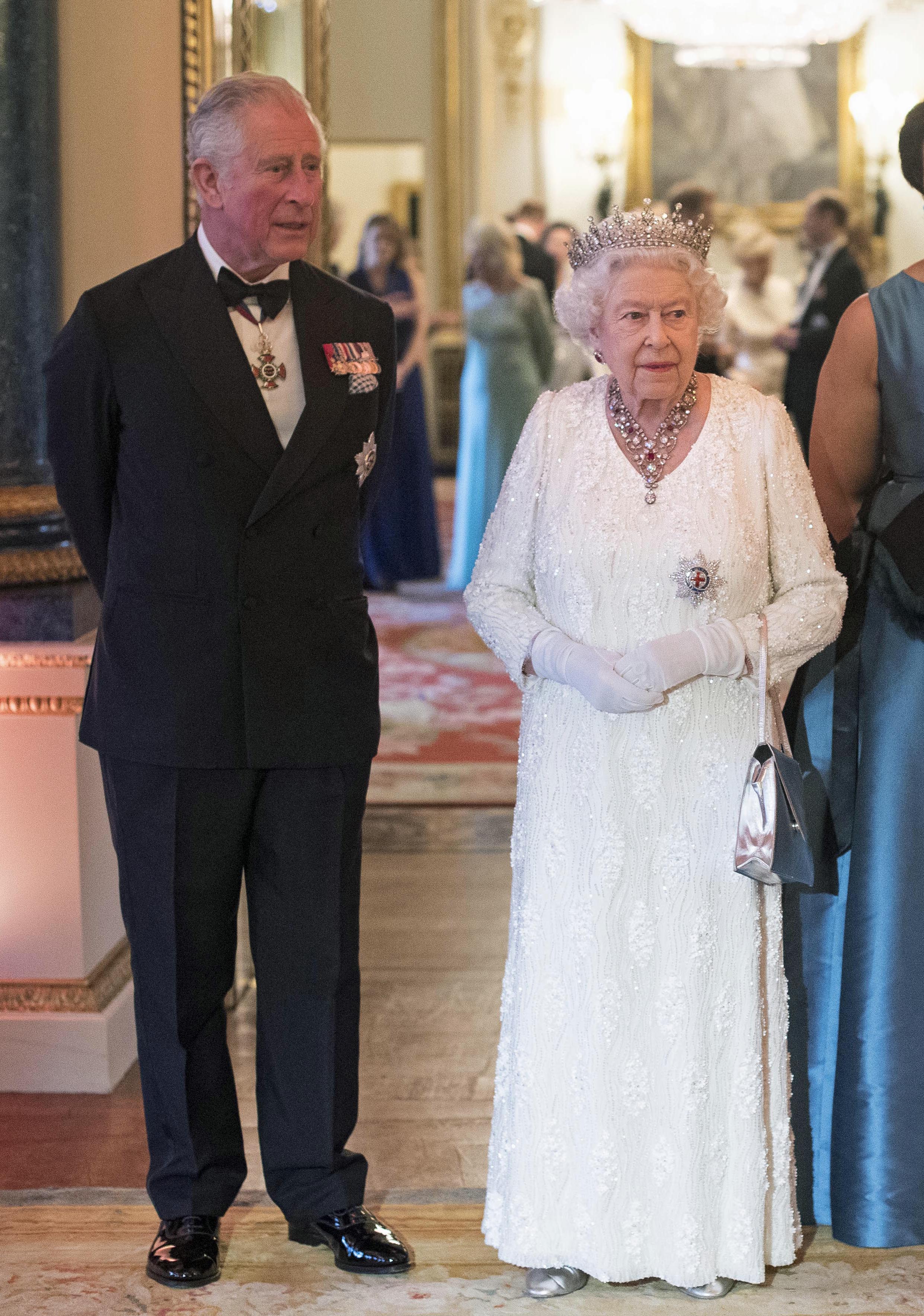 Queen Elizabeth II and Prince Charles, Prince of Wales in the Blue Drawing Room at The Queen's Dinner during the Commonwealth Heads of Government Meeting (CHOGM) at Buckingham Palace on April 19, 2018 in London, England.