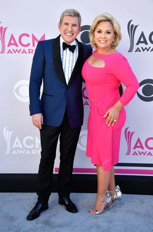 TV personalities Todd Chrisley (L) and Julie Chrisley attend the 52nd Academy Of Country Music Awards at Toshiba Plaza on April 2, 2017 in Las Vegas, Nevada.