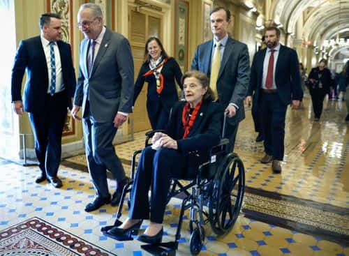 U.S. Senate Majority Leader Charles Schumer (D-NY) escorts Sen. Dianne Feinstein (D-CA) as she arrives at the U.S. Capitol following a long absence due to health issues on May 10, 2023 in Washington, DC. Feinstein was fighting a case of shingles and has been absent from the Senate for almost three months.