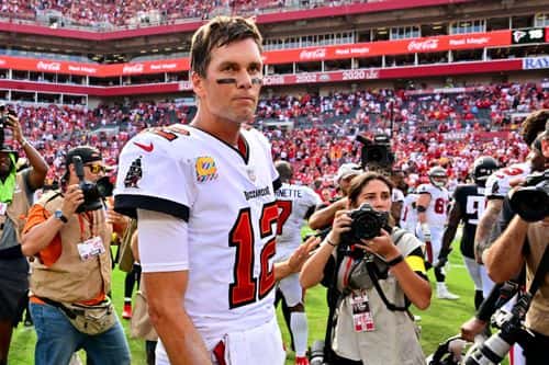 Tom Brady #12 of the Tampa Bay Buccaneers walks off the field after defeating the Atlanta Falcons 21-15 at Raymond James Stadium on October 09, 2022 in Tampa, Florida.