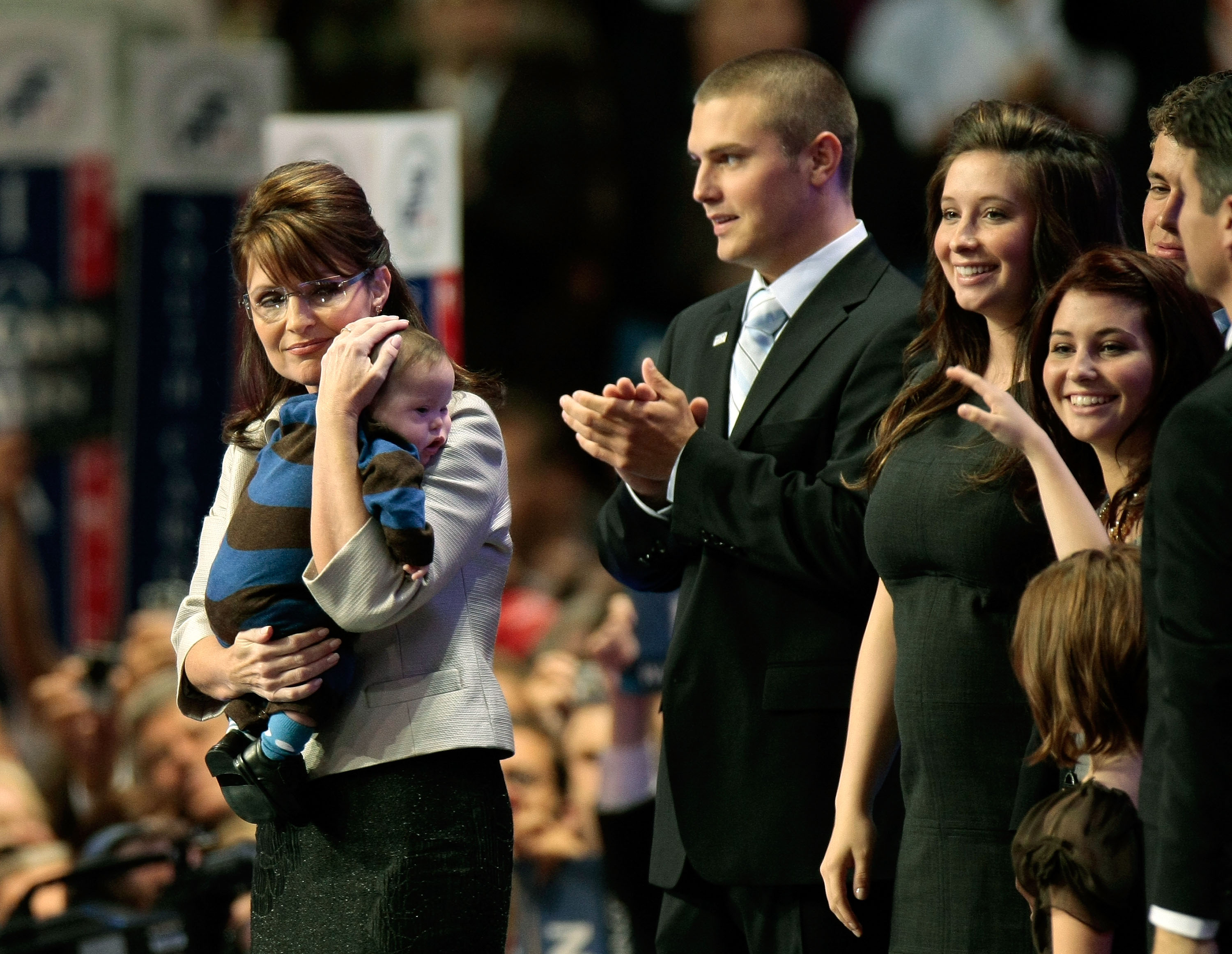 (L to R) Republican U.S vice-presidential nominee Alaska Gov. Sarah Palin holds her son Trig Palin as Track Palin, Bristol Palin and Willow Palin look on during day three of the Republican National Convention (RNC) at the Xcel Energy Center on September 3, 2008, in St. Paul, Minnesota. (Getty Images)