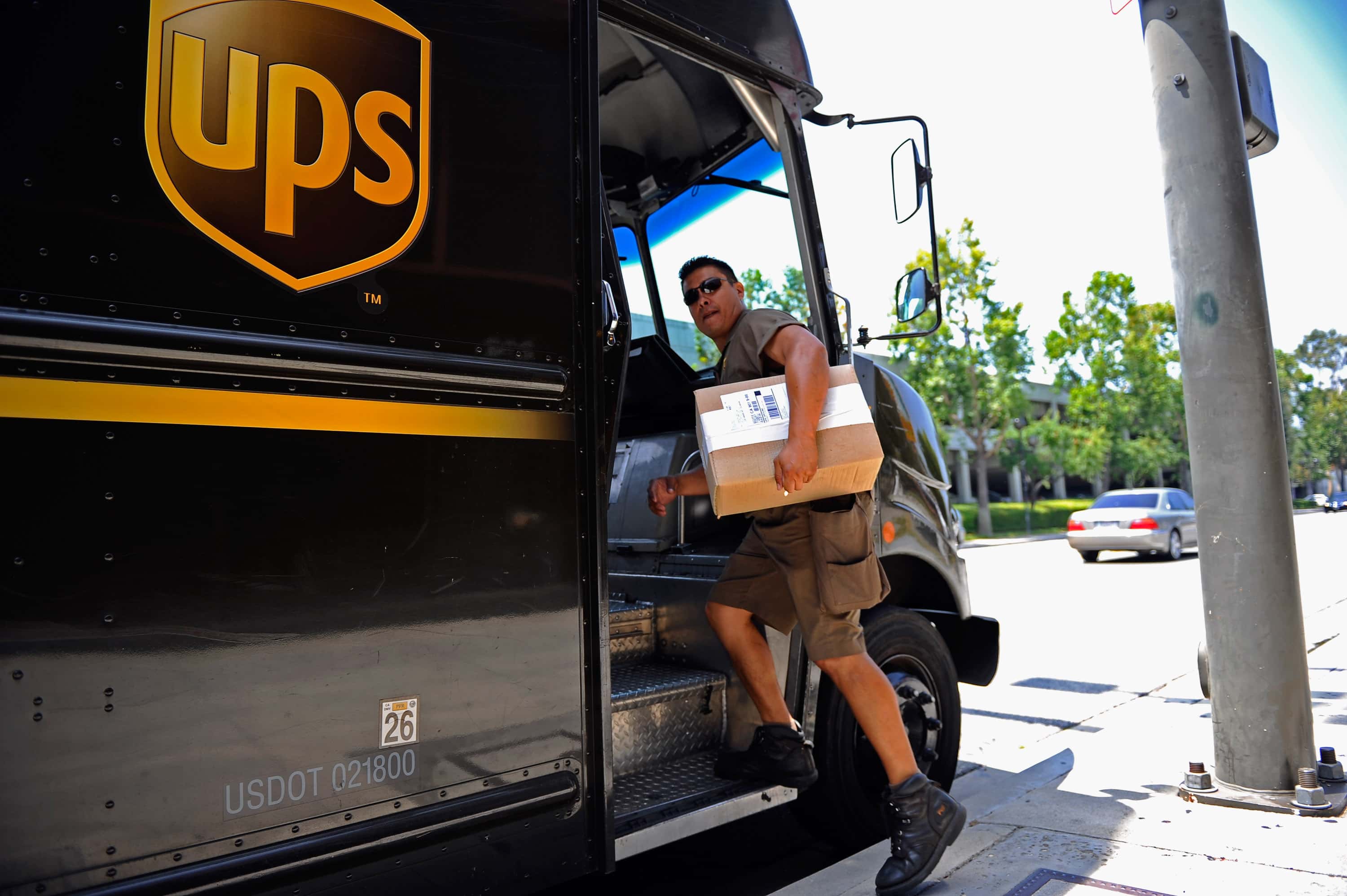A United Parcel Service (UPS) driver delivers packages on July 22, 2010 in Glendale, California. UPS said its second quarter profit nearly doubled posting a net profit of $845 million, or 84 cents a share, compared to $445 million or 44 cents a year ago.
