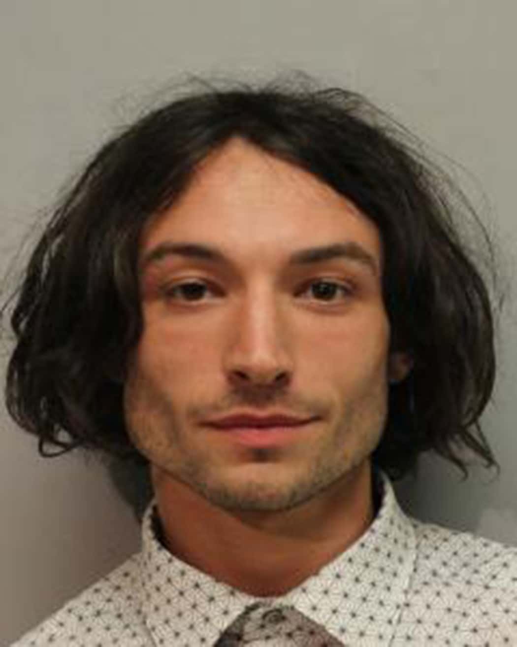 (EDITORS NOTE: Best quality available) In this handout image provided by  Hawaiʻi Police Department, Ezra Miller is seen in a police booking photo after his arrest for disorderly conduct and harassment on March 28, 2022 in Hilo, Hawaii.