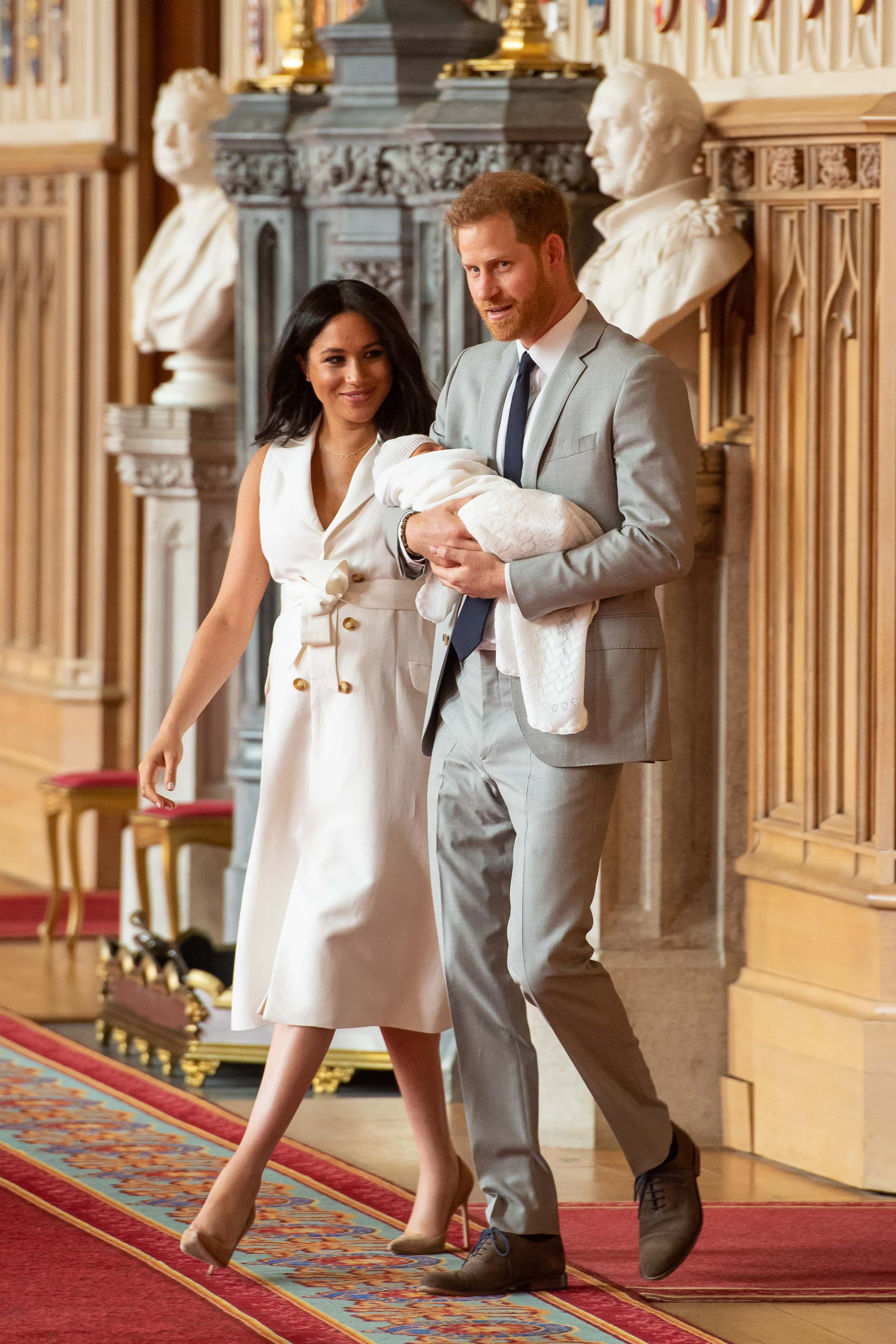 Prince Harry, Duke of Sussex and Meghan, Duchess of Sussex, pose with their newborn son Archie Harrison Mountbatten-Windsor during a photocall in St George's Hall at Windsor Castle on May 8, 2019 in Windsor, England. The Duchess of Sussex gave birth at 05:26 on Monday 06 May, 2019. (Photo by Dominic Lipinski - WPA Pool/Getty Images)